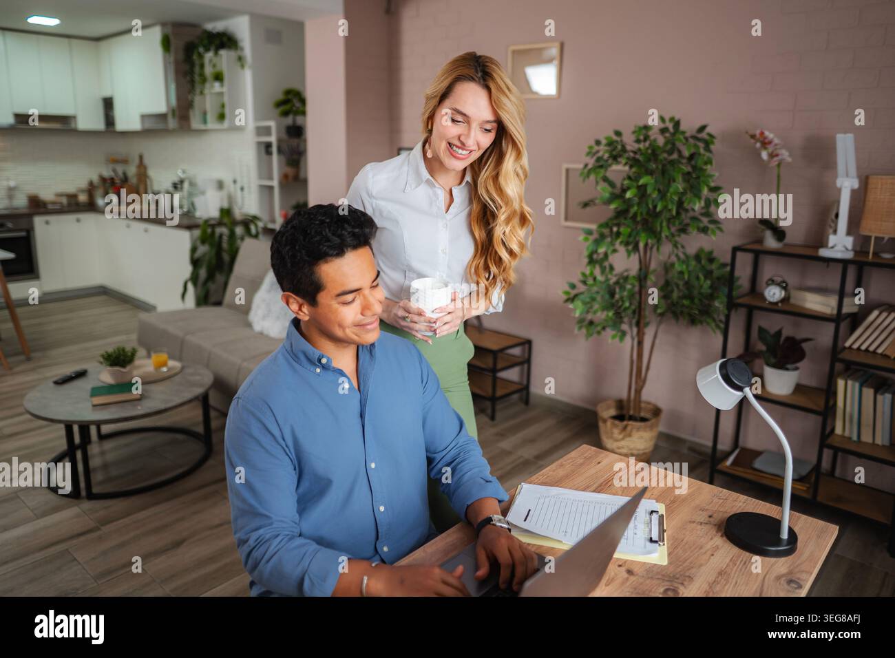 Young couple collaborating creating good teamwork at home office Stock Photo