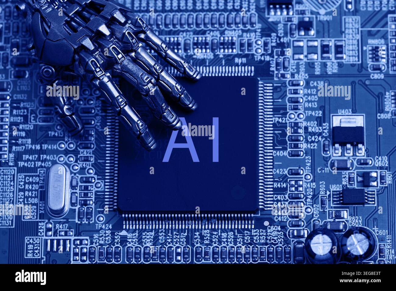 Robot hand touching ai processor on circuit board Stock Photo