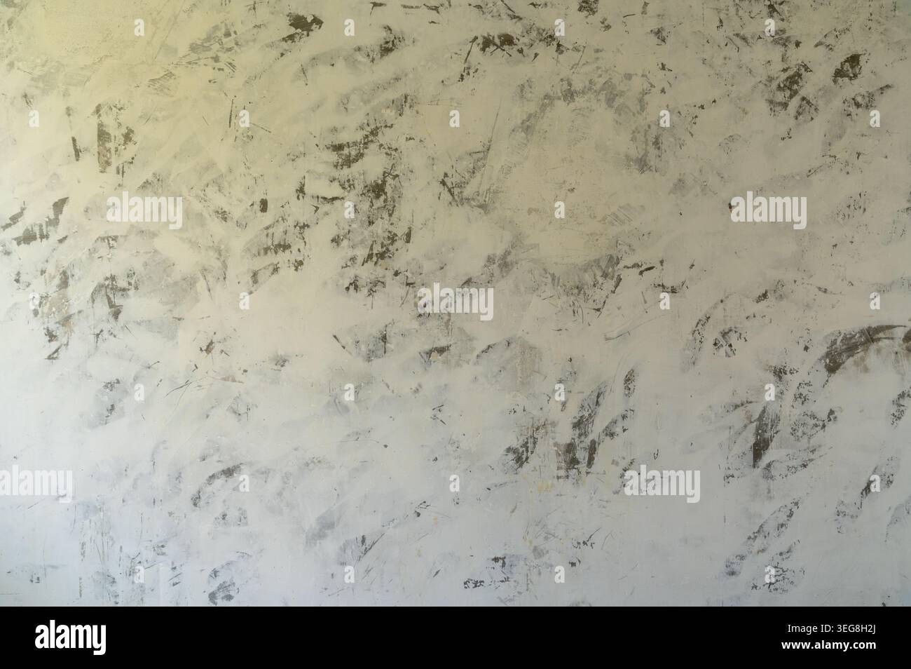 Textured plaster wall with mottled finish close up. Stock Photo