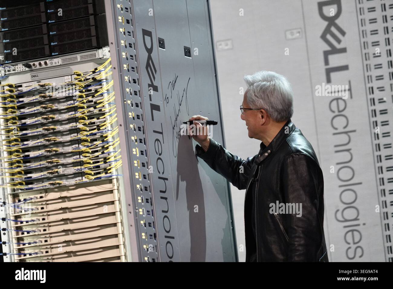 CEO of NVIDIA Jensen Huang signs a DELL machine at Dell Technologies ...