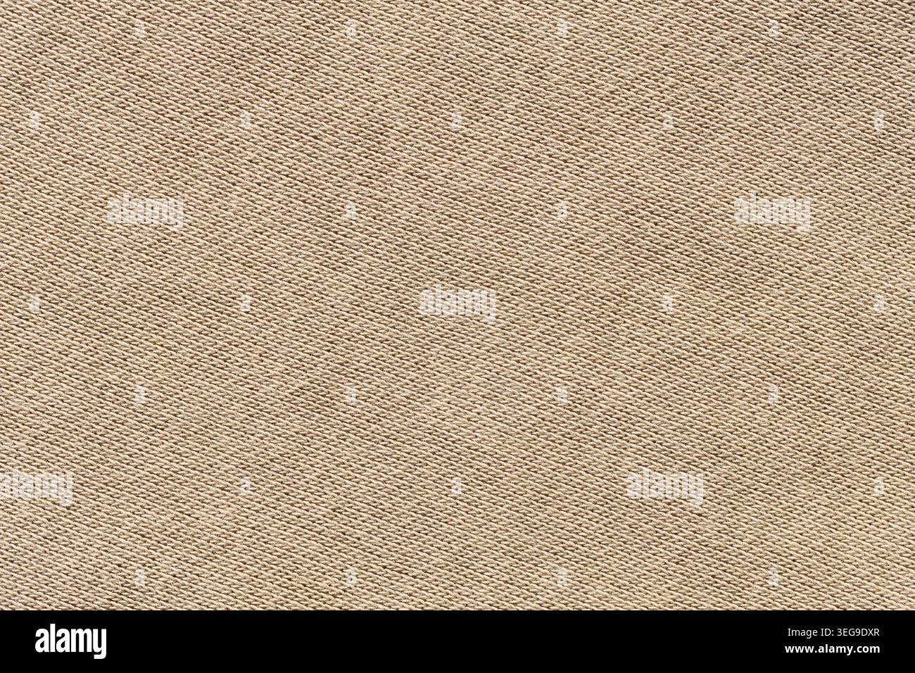 Beige woven canvas fabric texture background with diagonal pattern close-up Stock Photo