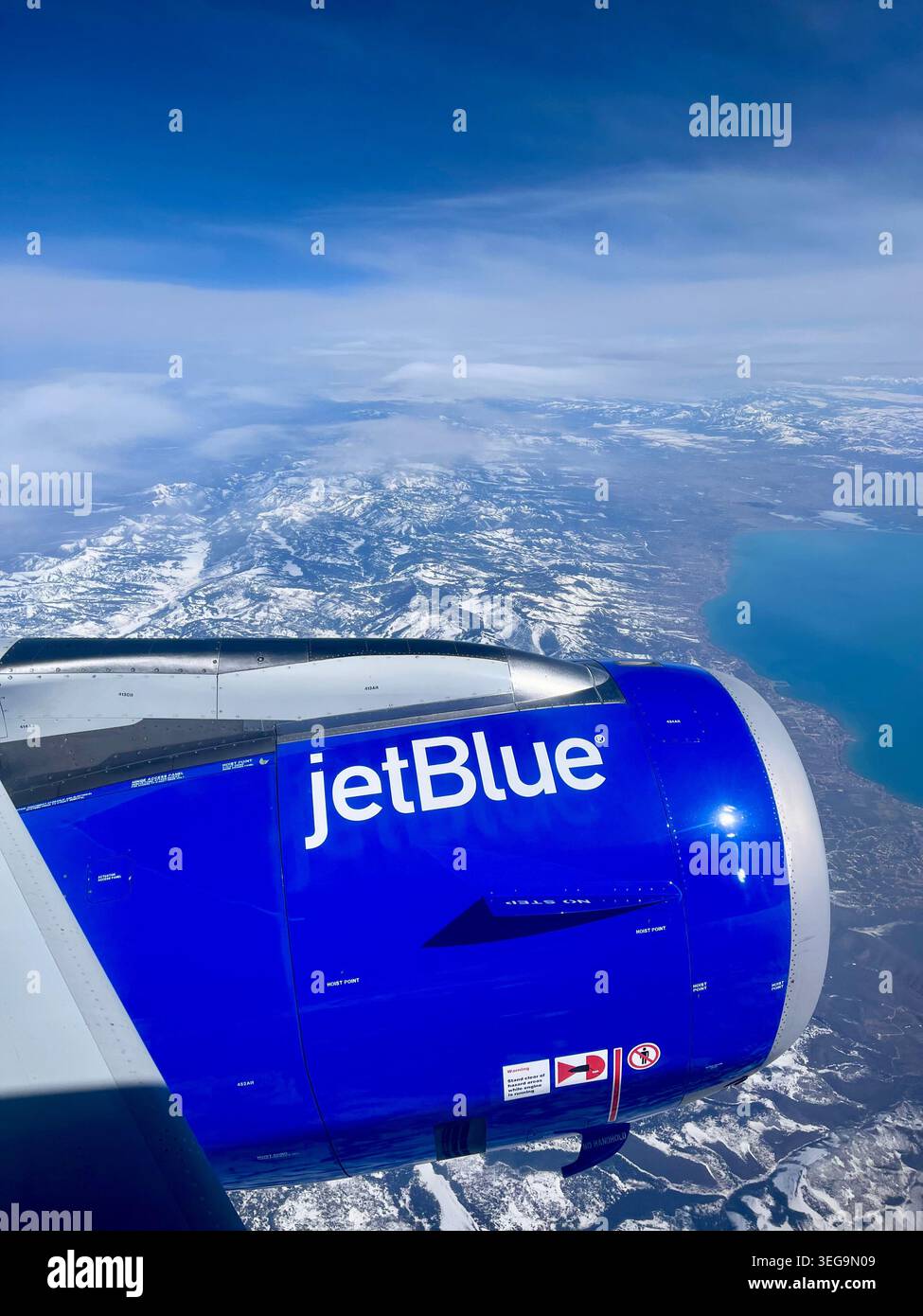 Jet engine over Utah’s Wasatch Mountains. - Smartphone Captured Stock Image