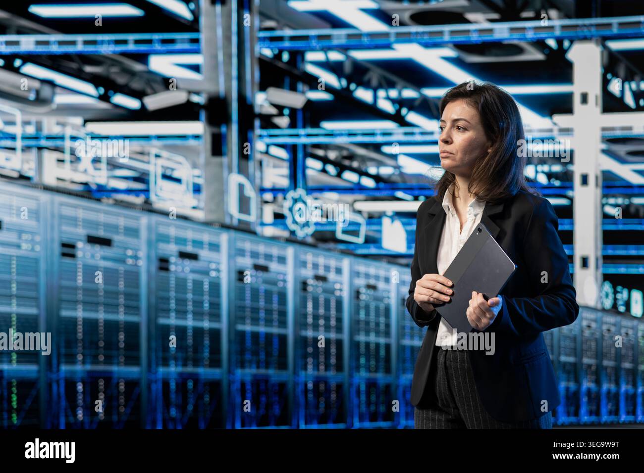 Server farm employee walking through supercomputer rows, looking at computer graphics HUD visualizations. Data center professional analyzing AR infrastructure virtualization mapping Stock Photo