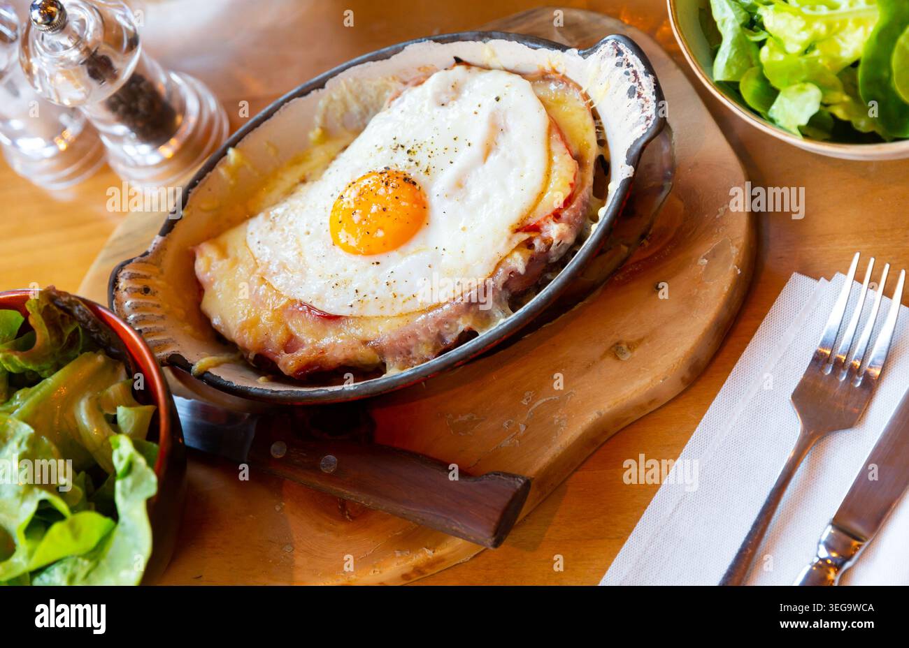 Swiss cheese crust with fried egg Stock Photo