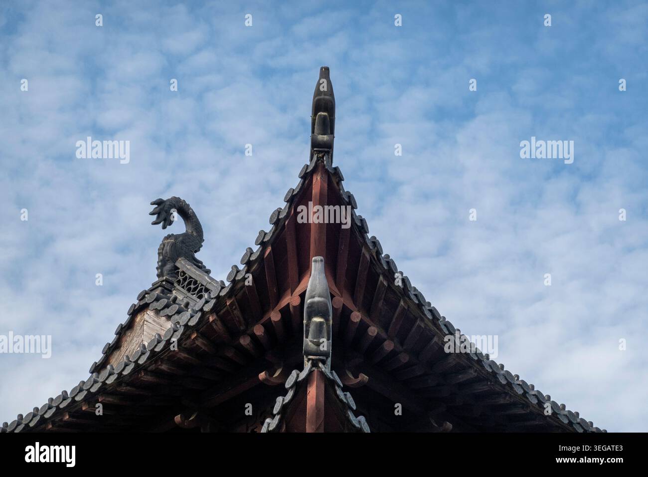 Chinese Rafters HAINING, CHINA - MAY 9, 2026: Low-angle detail of a traditional Chinese ...