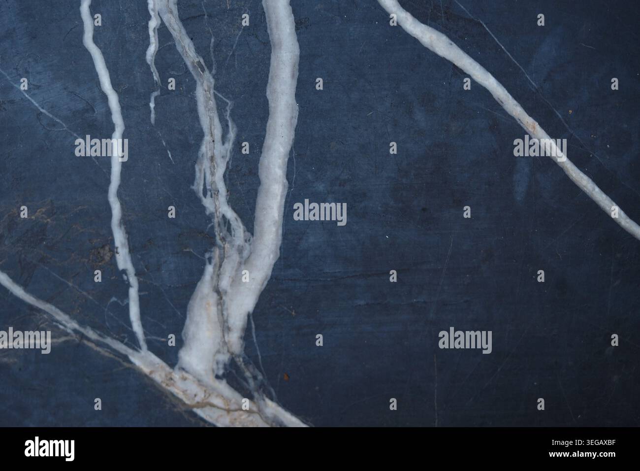 Marble surface with white veins on dark background Stock Photo