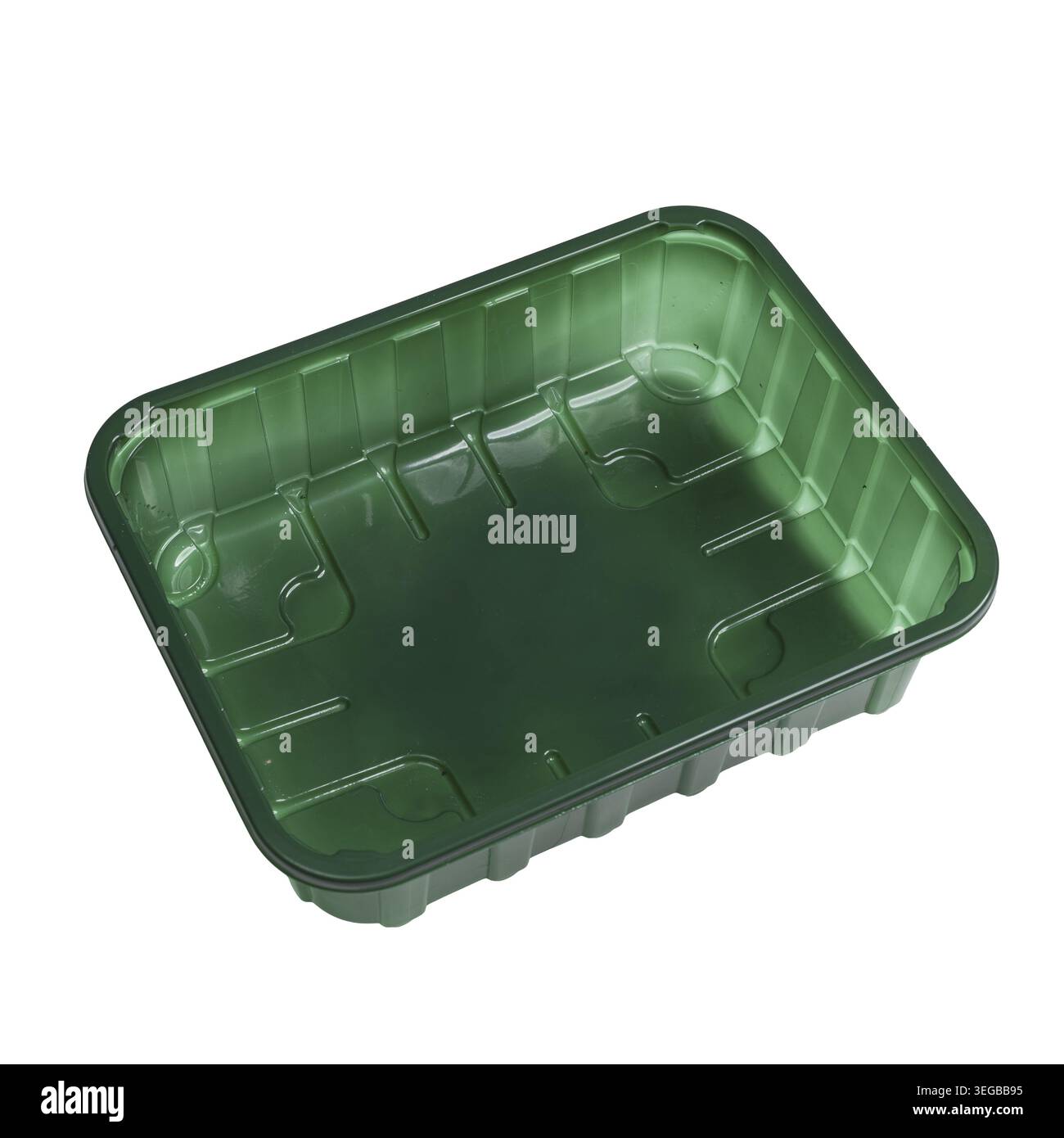 A green plastic food container on a clear surface Stock Photo