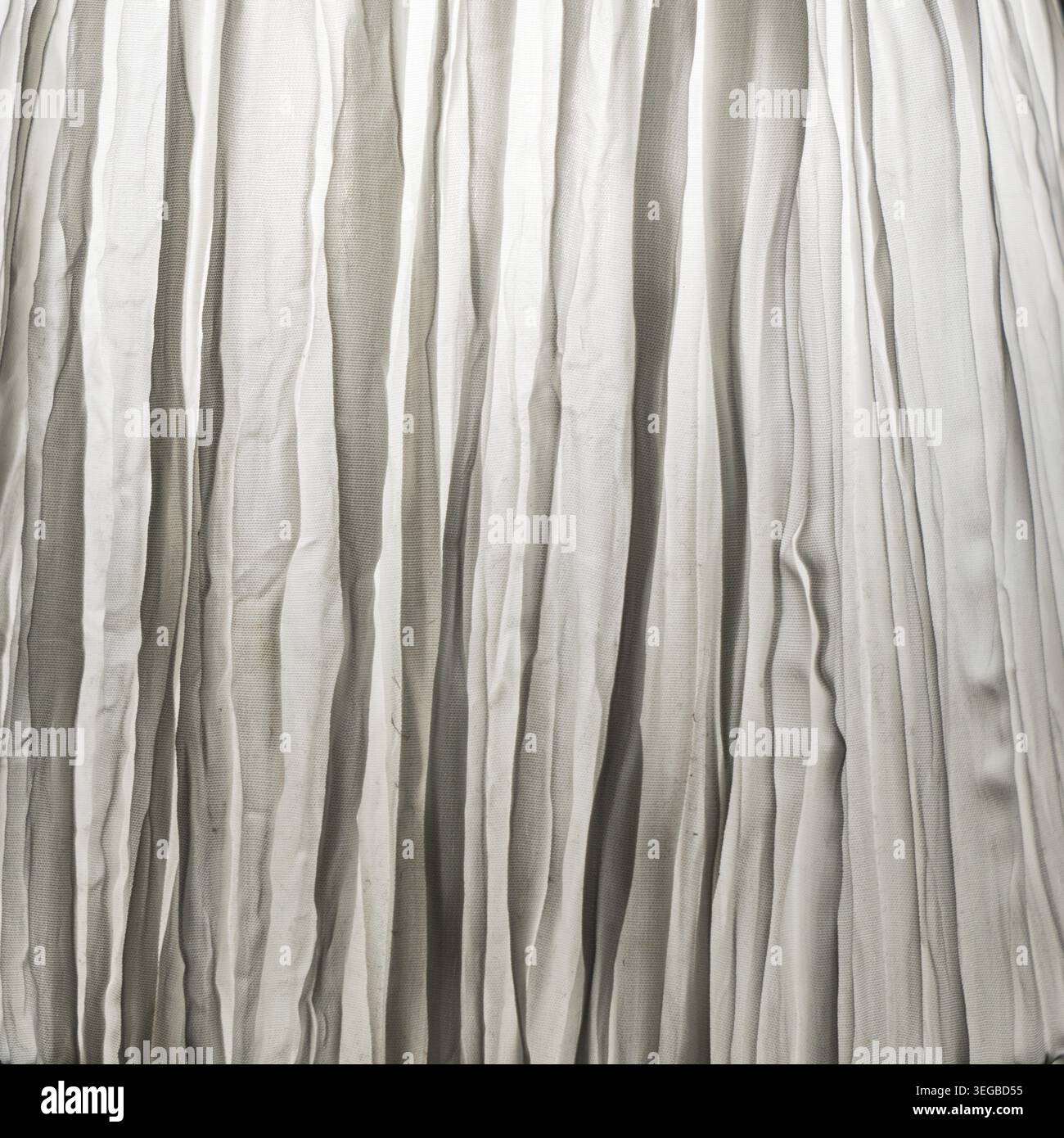A crumpled white curtain as a background Stock Photo