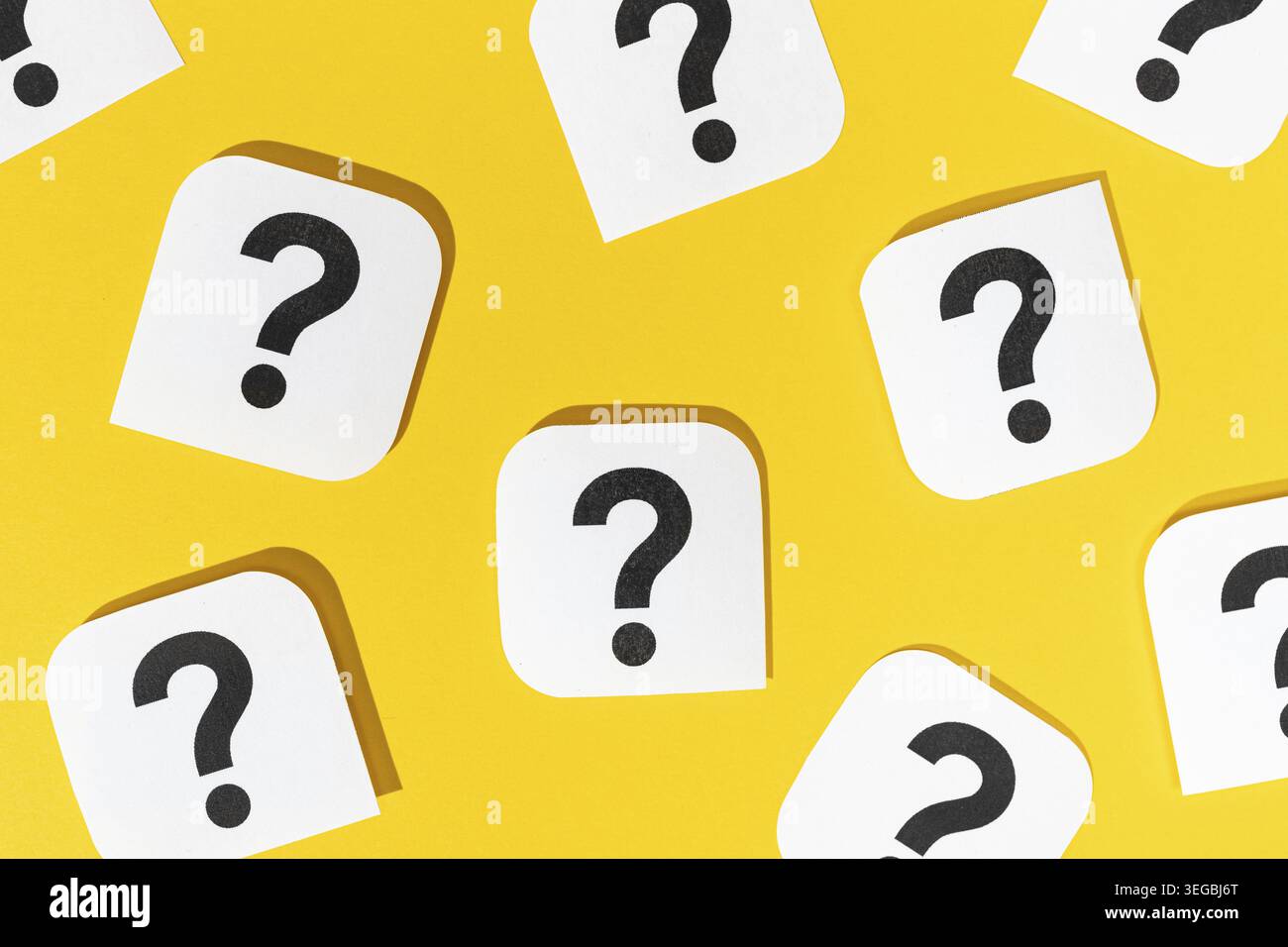 Many Question marks signs on yellow background Stock Photo