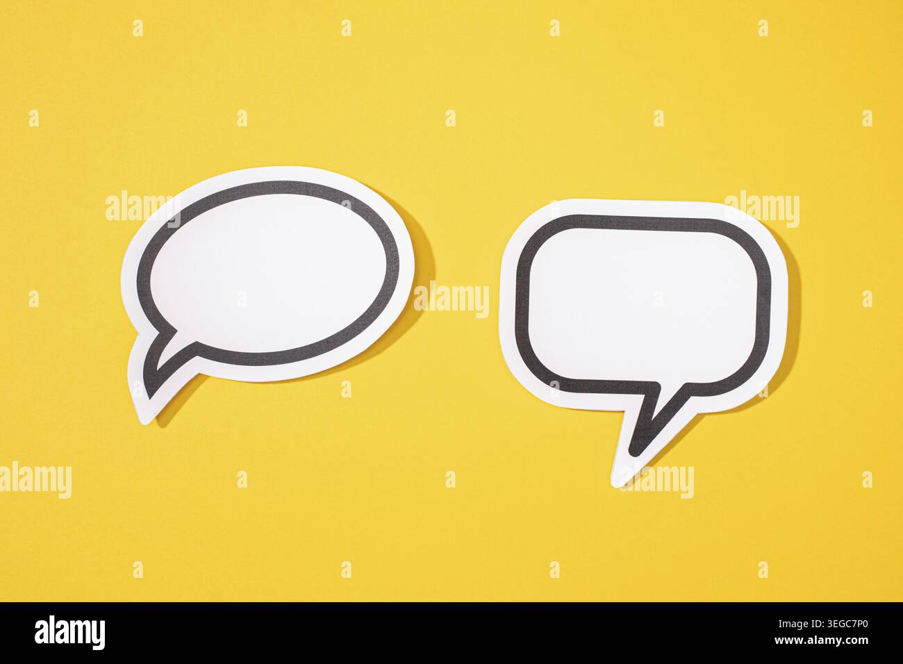 Two Blank Speech Bubble isolated on yellow background. Mock up template Stock Photo