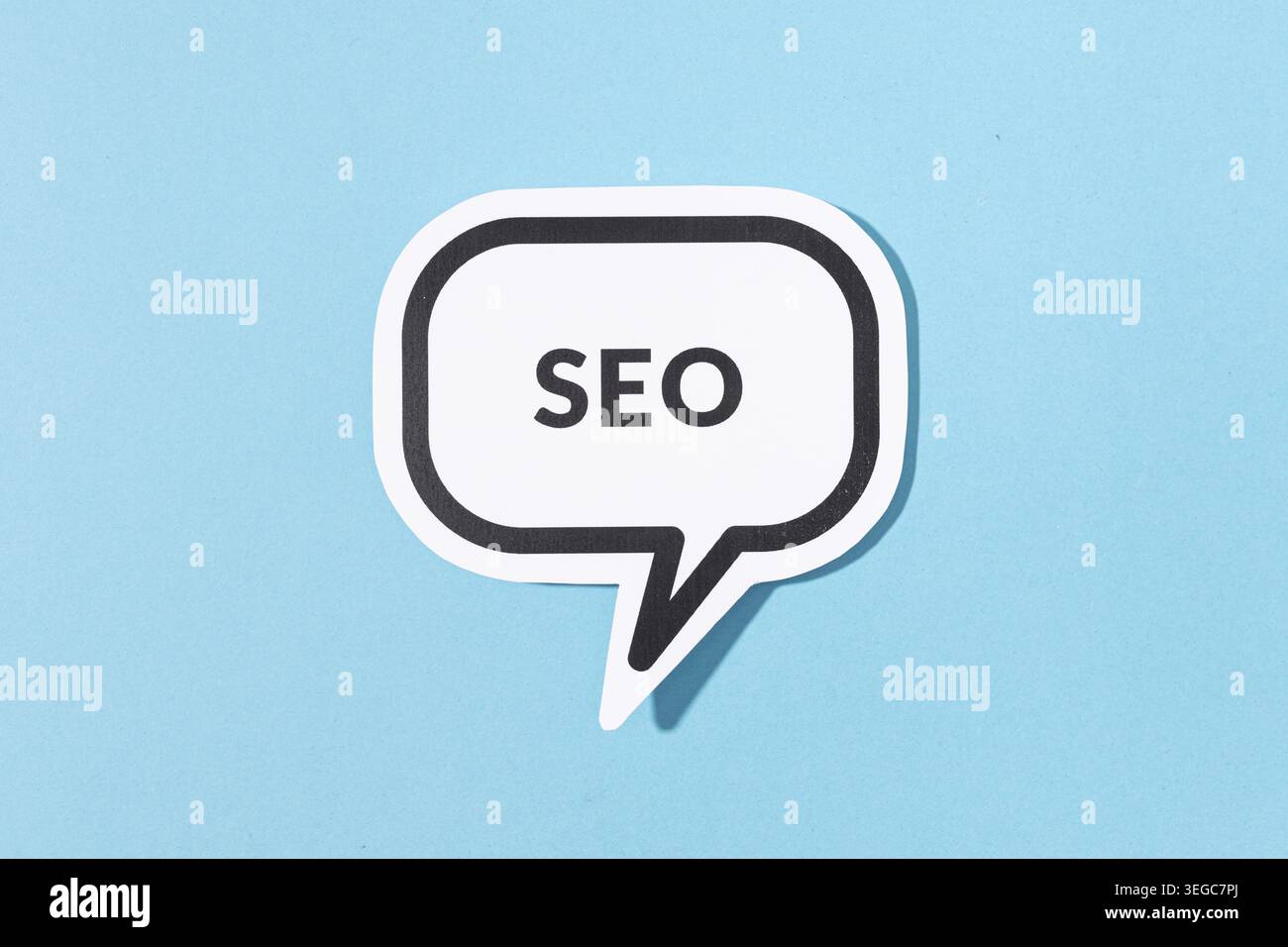 SEO text on speech bubble isolated on blue background Stock Photo