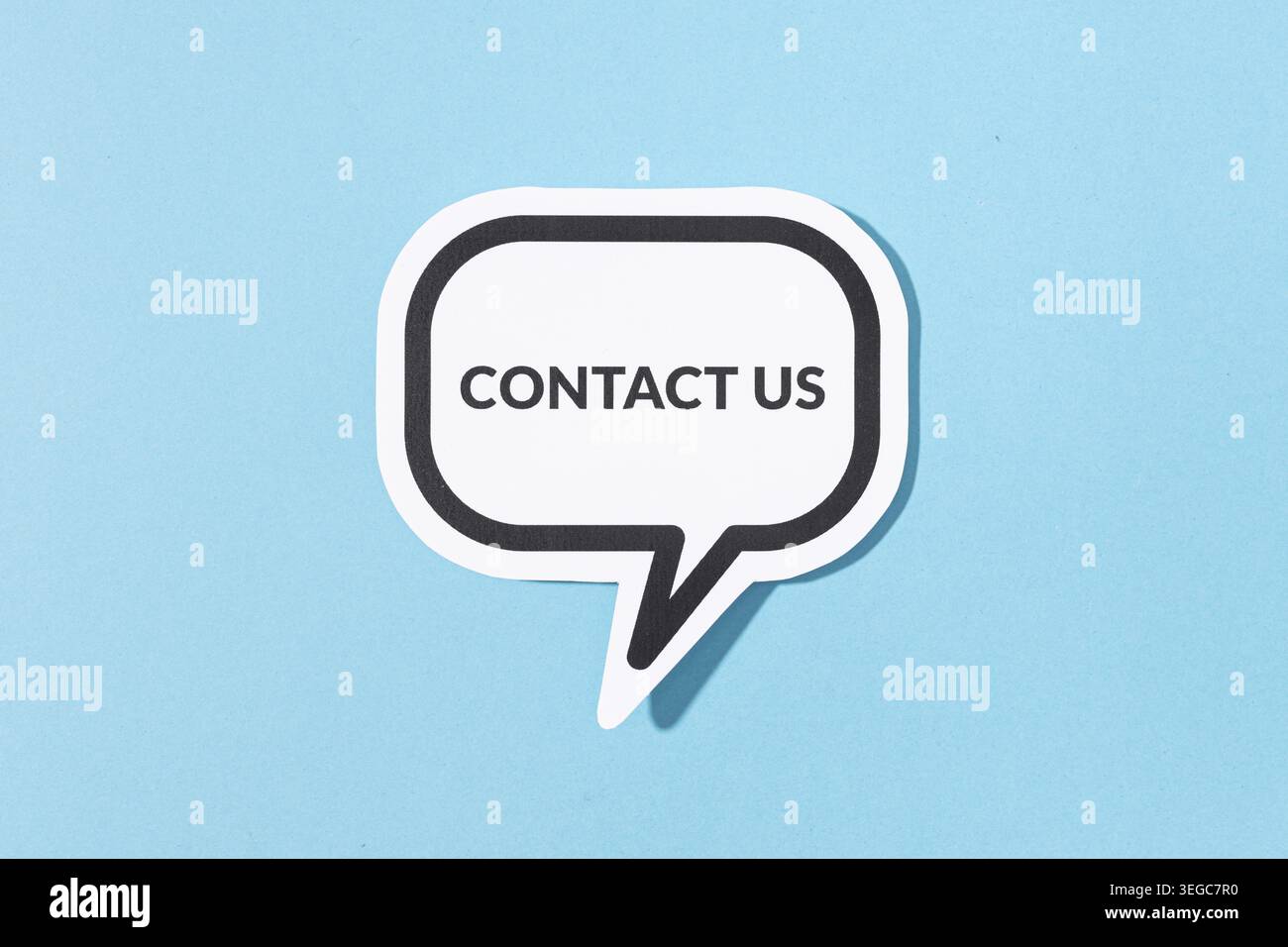 Contact Us text on speech bubble isolated on blue background Stock Photo