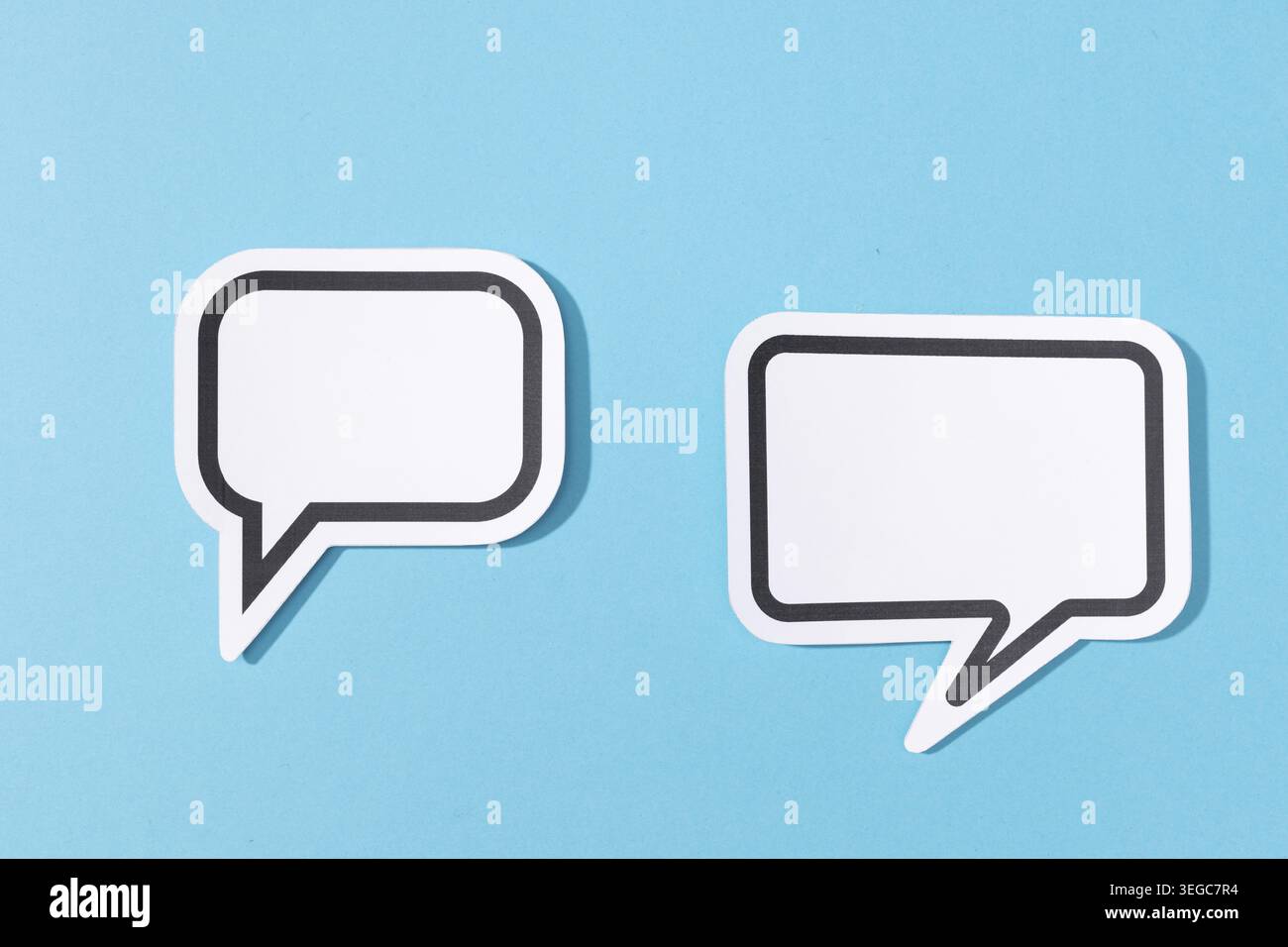 Two Blank Speech Bubble isolated on blue background. Mock up template Stock Photo