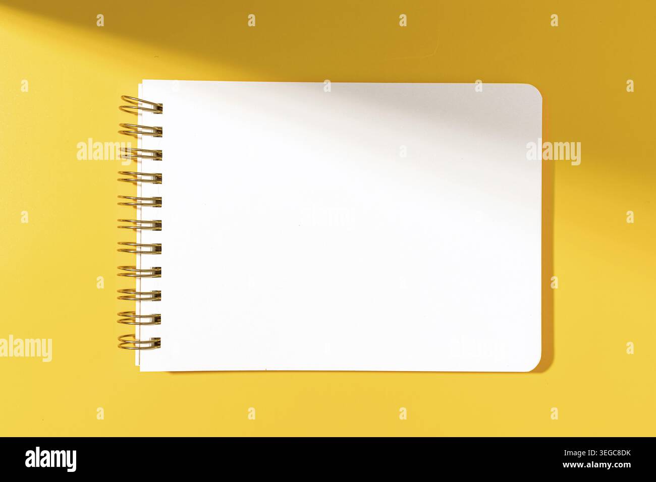 Blank paper notebook Isolated on yellow background. Template mock up Stock Photo