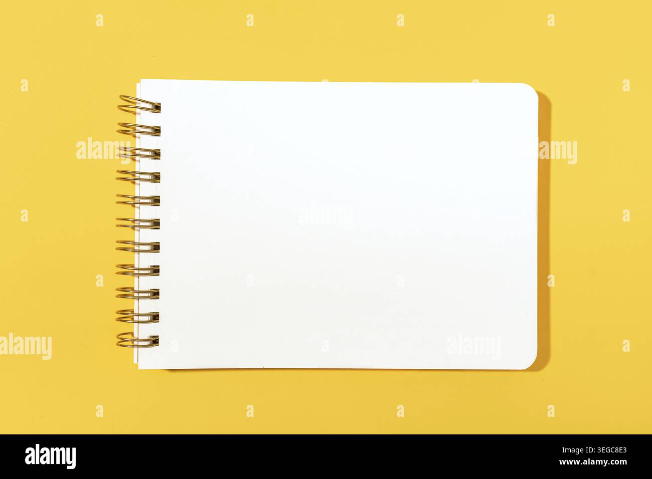 Blank paper notebook Isolated on yellow background. Template mock up Stock Photo