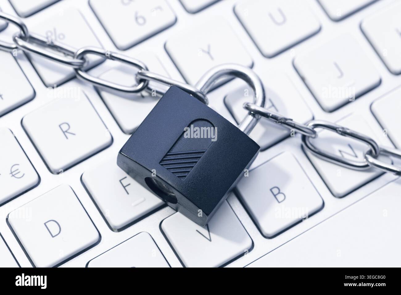 Computer Security and data privacy concept. Chain and padlock on keyboard Stock Photo