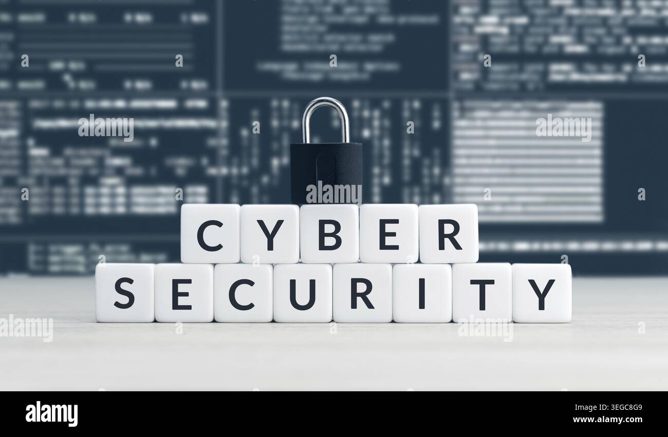 Cyber security words on cube blocks, closed padlock and computer data screen at background Stock Photo