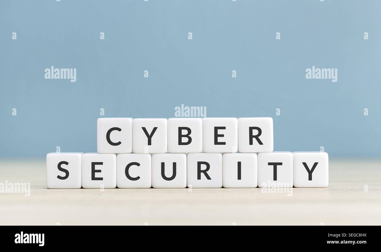 Cyber security concept. Text on cube blocks on blue background. Copy space Stock Photo