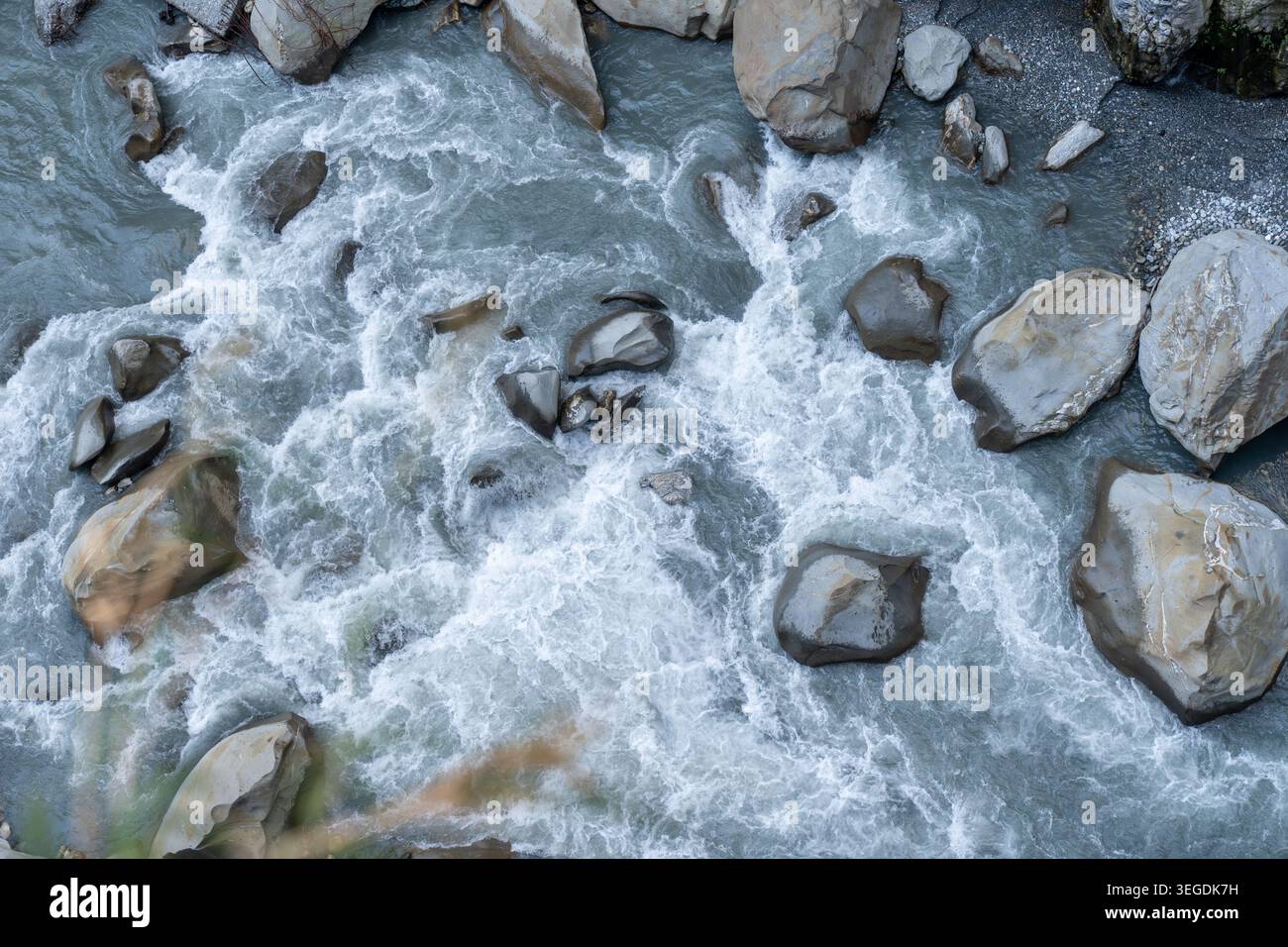 Powerful river rapids flowing over large natural rocks Stock Photo