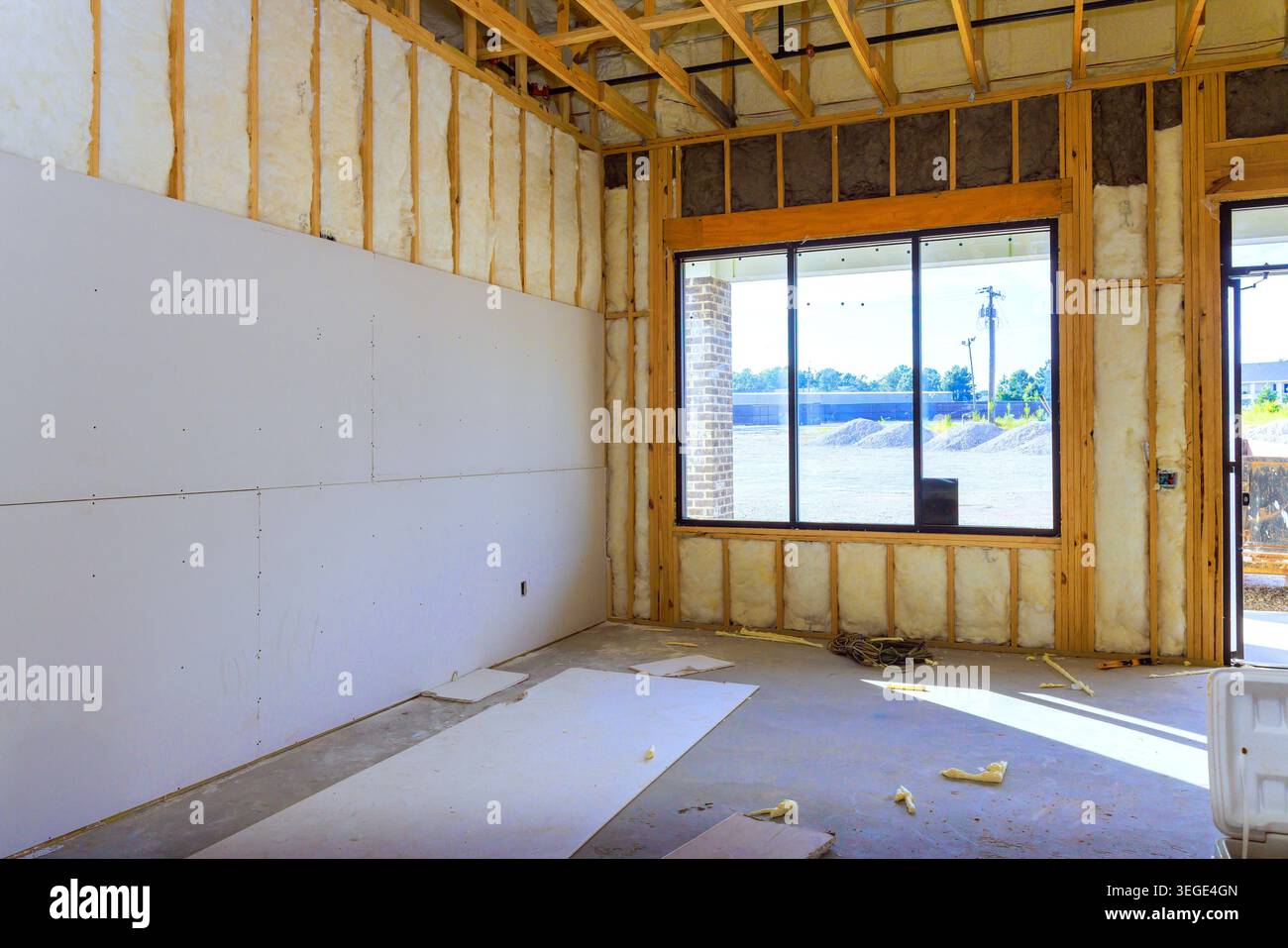 Workers are preparing space for future construction with drywall open framing inside. Stock Photo