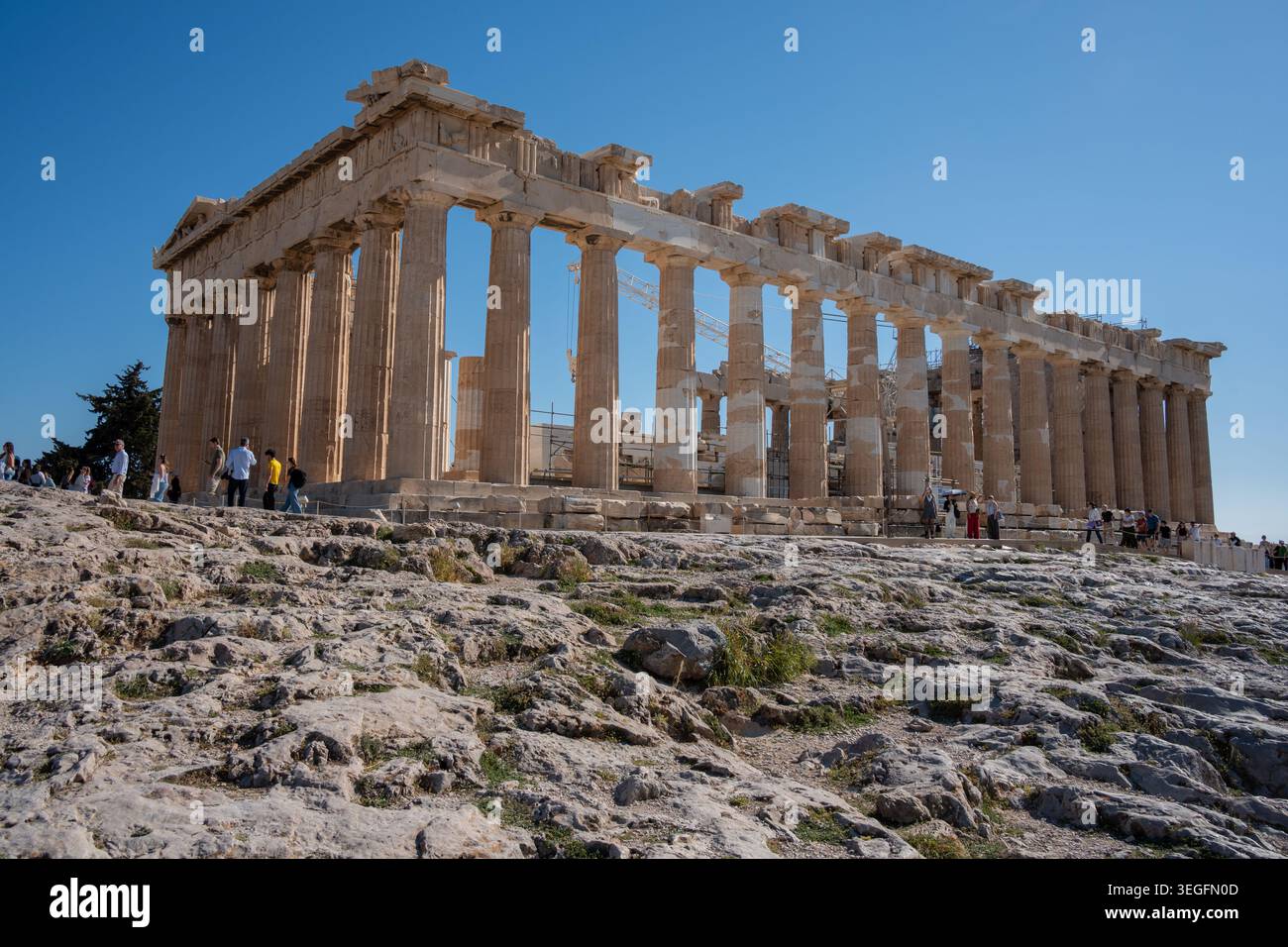 Close-up view of the majestic Parthenon temple with its ancient marble columns under a bright blue sky, Athens, Greece. Stock Photo