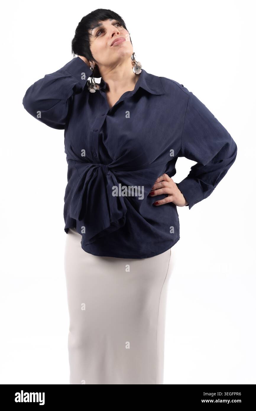 Pensive elegant middle aged woman looking up thoughtfully isolated Stock Photo