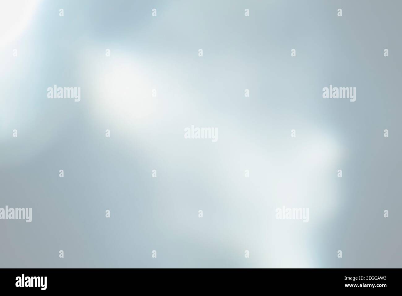 Soft pale blue and white abstract blurred gradient background Stock Photo