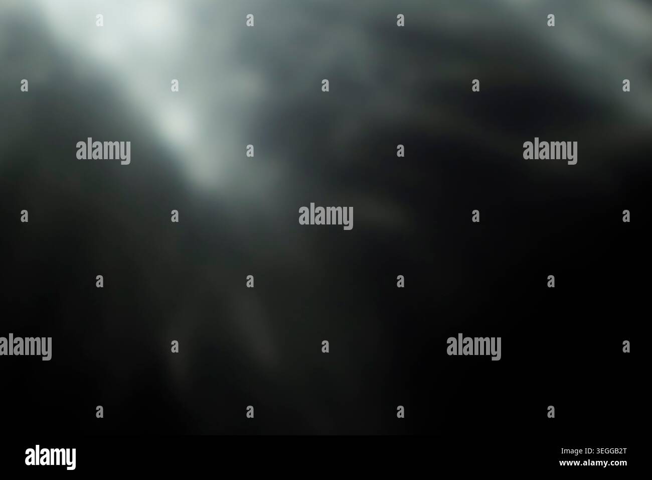 Moody dark abstract background with diagonal light rays and smoky texture Stock Photo