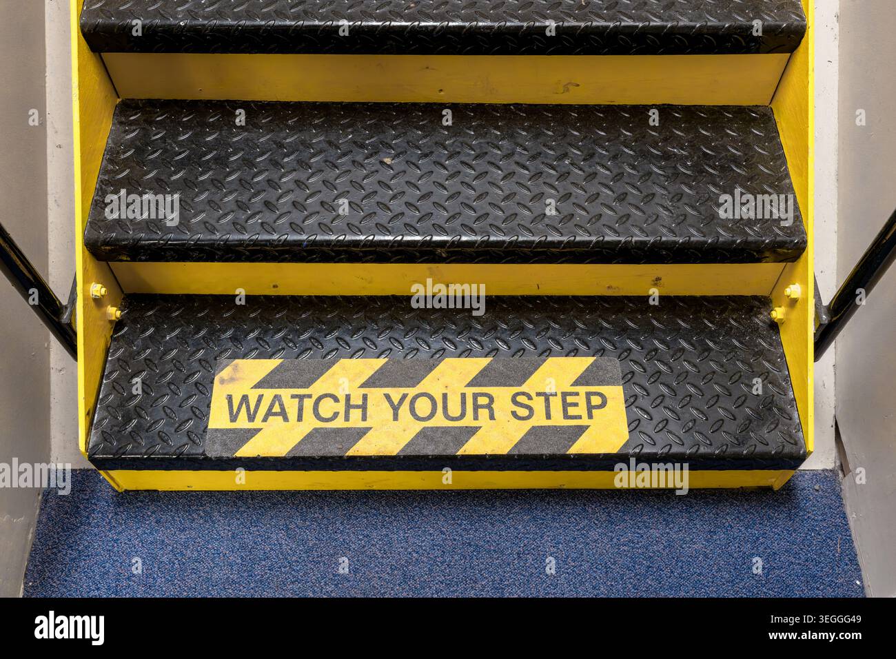 Stacase Sign Watch your step warning sign on metal staircase with anti slip treads ...
