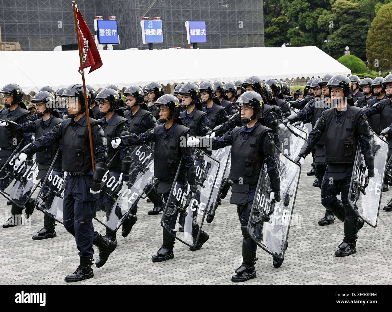 Members of the Metropolitan Police Department's riot squad march during ...