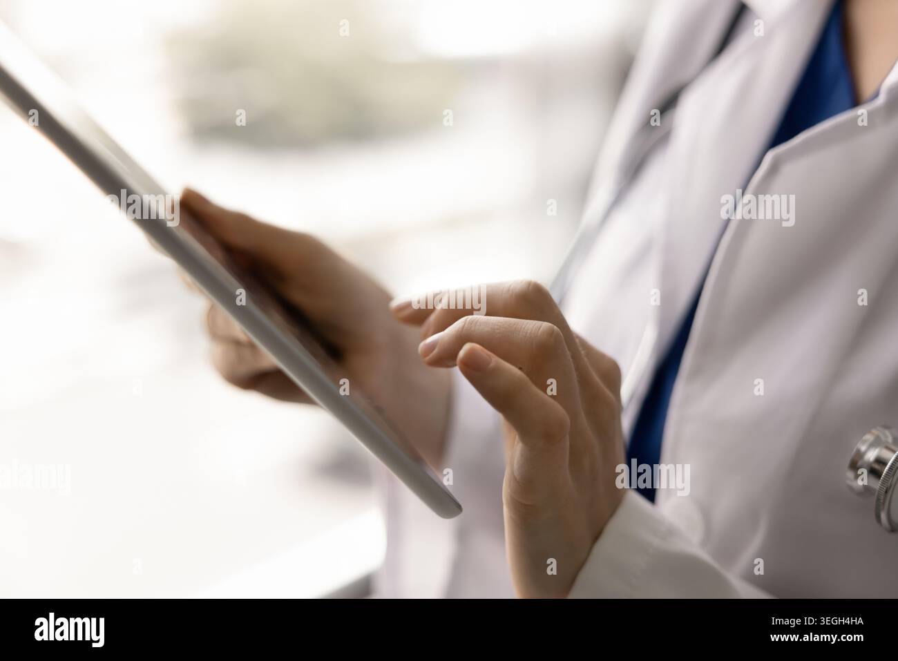 Closeup of female doctor hands holding digital tablet Stock Photo