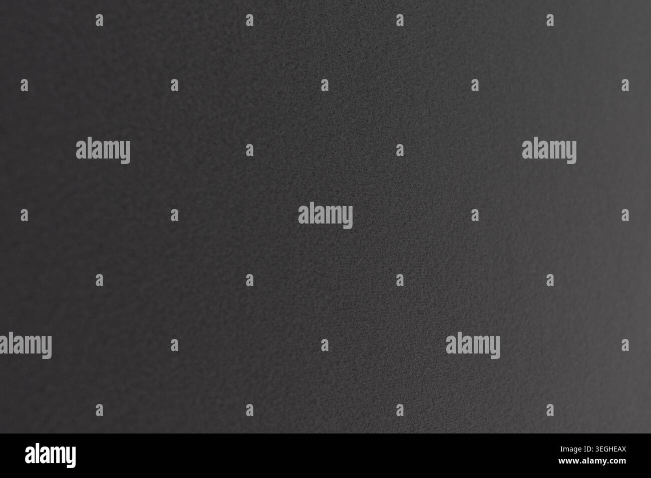 Grey gritty texture creating an abstract noise background surface Stock Photo