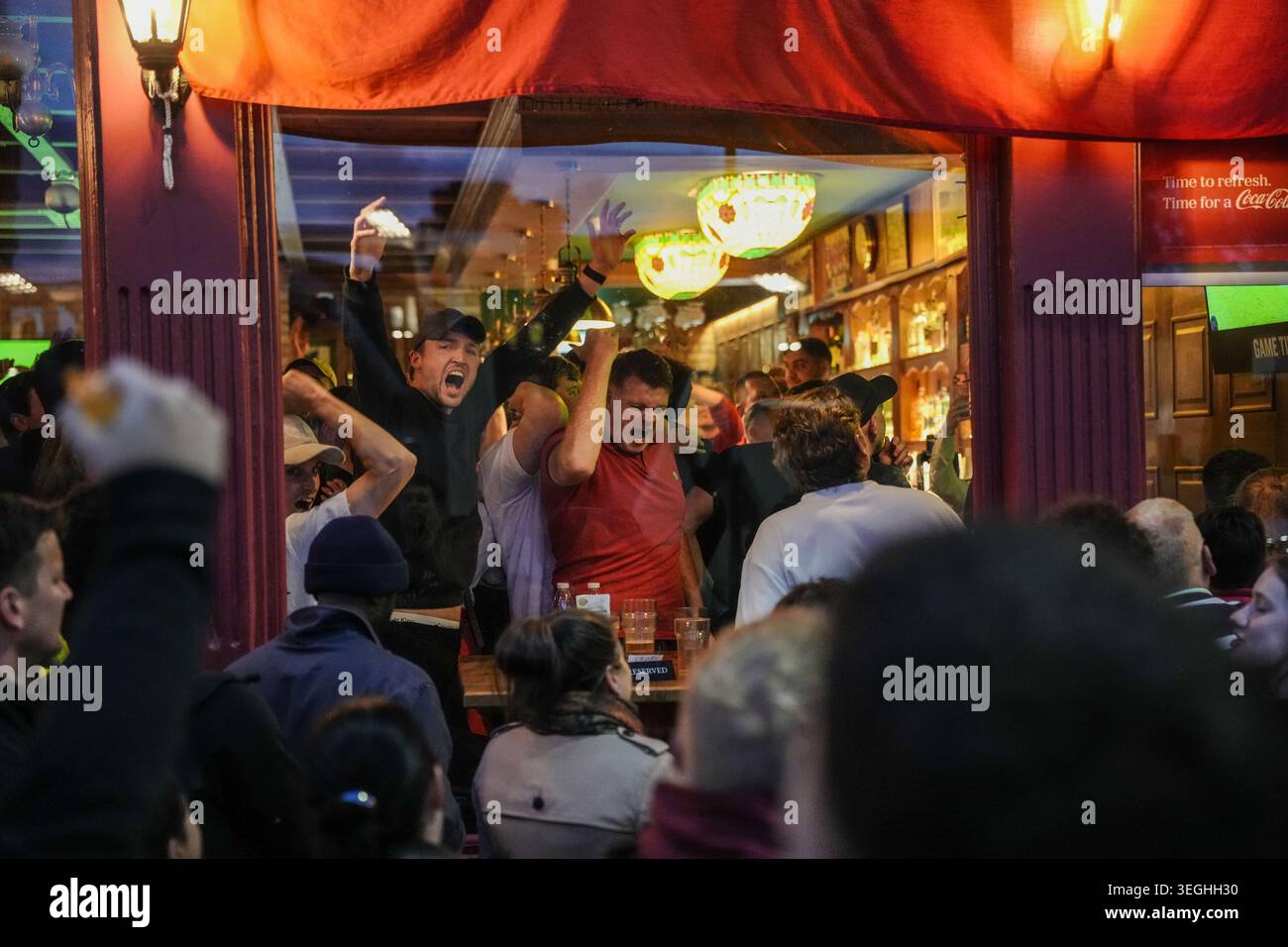 Arsenal fans celebrate in a pub near the Emirates Stadium, London ...