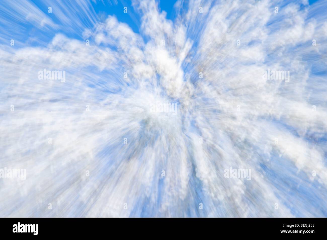 Abstract blurred background with white bokeh dots on a soft blue sky.  Stock Photo