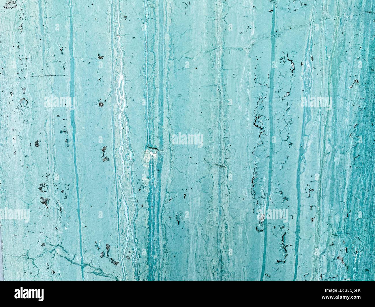 Turquoise Weathered Wall Texture with Cracks and Peeling Paint Stock Photo