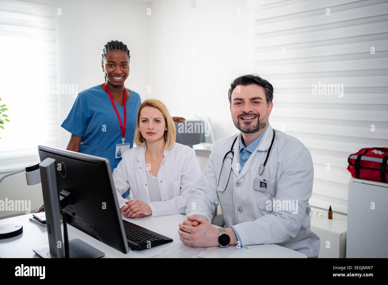 Diverse medical team working together in clinic office Stock Photo