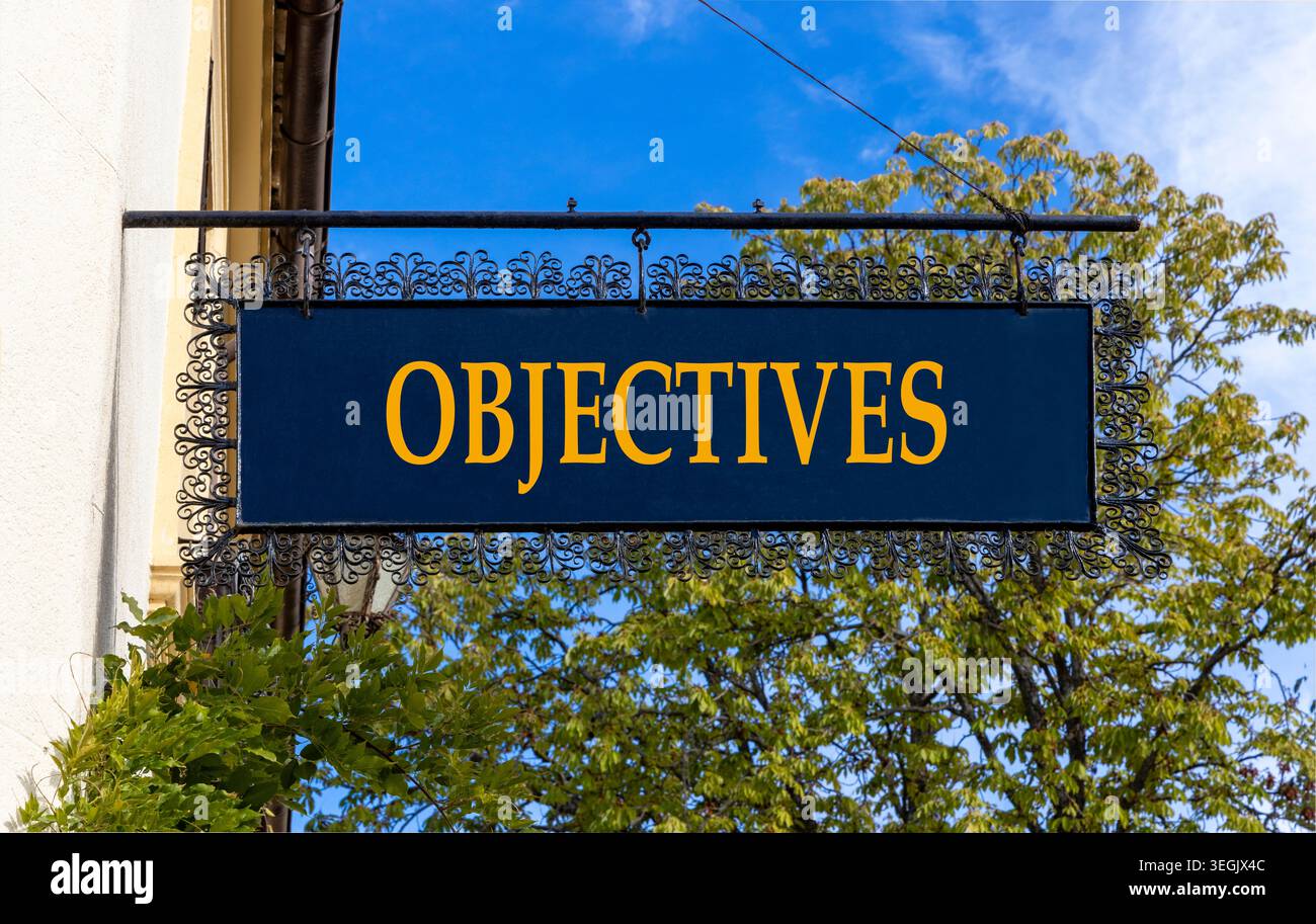 Objectives symbol. Concept word Objectives on beautiful black road sign ...