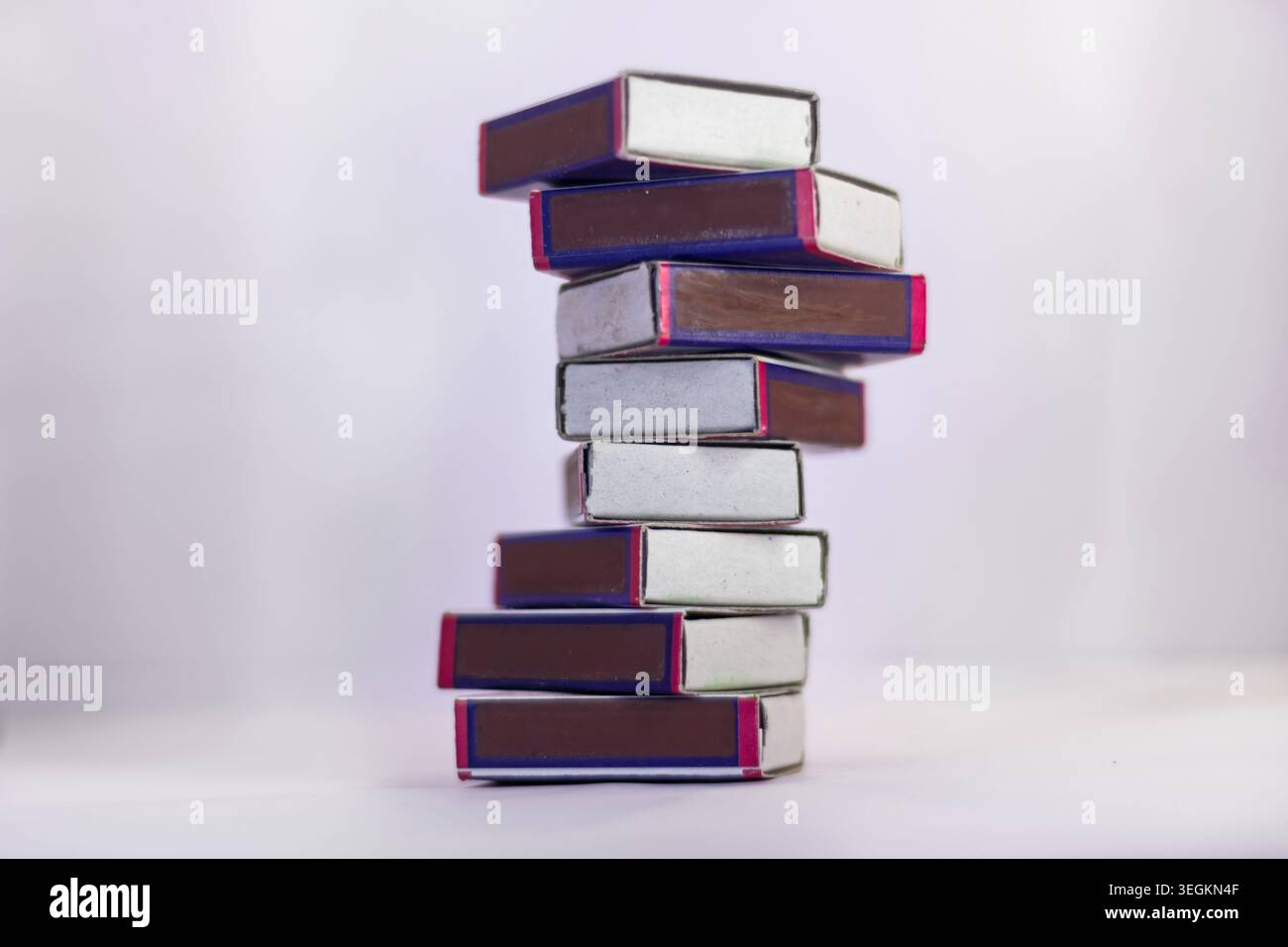 Match boxes arranged in stack isolated from white background Stock Photo