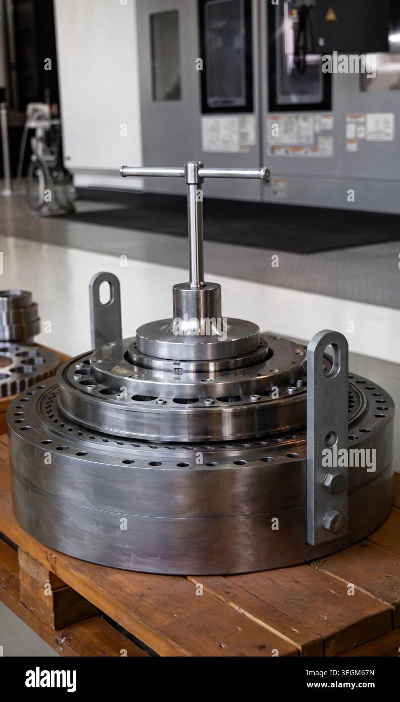 Precision Industrial Mechanical Component in Modern Manufacturing Facility Stock Photo