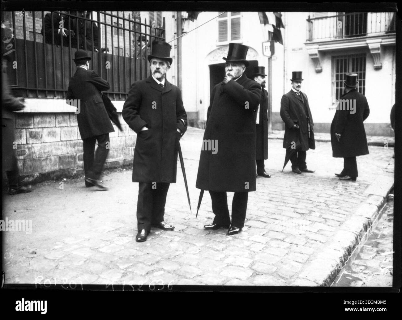 Georges Clemenceau and Louis Lépine attend a commemorative ceremony in Choisy-le-Roi on 23 February 1908. The press photograph records the French political and civic leaders during the Belle Époque period, highlighting local ceremonial practices. Stock Photo