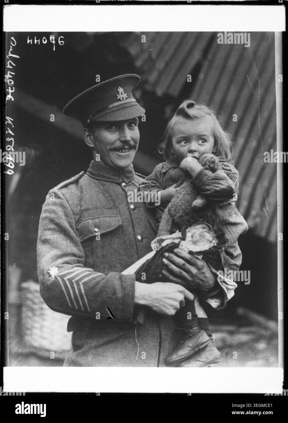 Quartermaster Rabjohn holds his daughter during a German air raid in ...