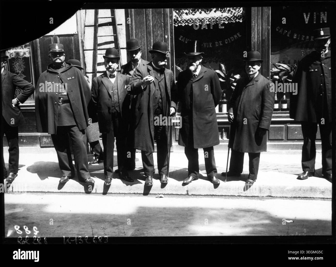 Louis Lépine greets striking postal workers during the May 1909 postal strike in France, interacting with personnel in uniform outside the post offices, highlighting labor unrest in the early 20th century and governmental oversight. Stock Photo
