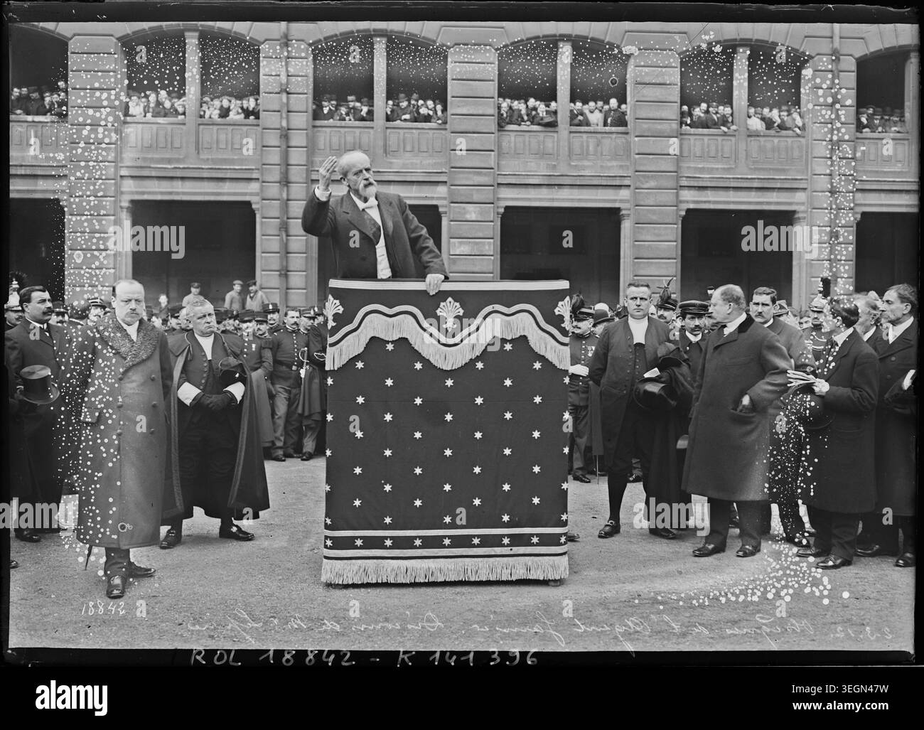 Louis Lépine delivers a funeral speech in Paris on March 2, 1912, during the ceremonies for agent Garnier, captured in a press photograph documenting the event in monochrome format. Stock Photo