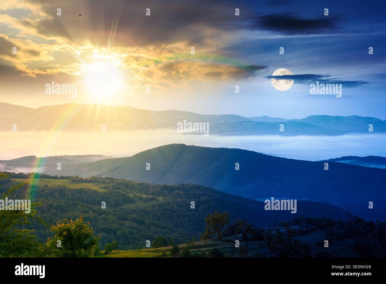 day meet night. foggy carpathian countryside on summer solstice. view of mountainous landscape with rural fields on rolling hills. sun and moon over f Stock Photo