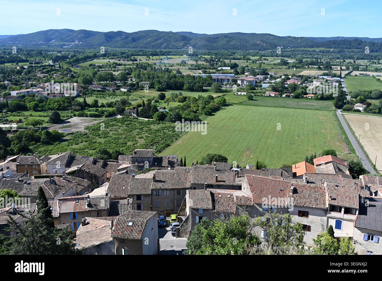 Panorama or Panoramic view over Rooftops of Cadenet, the Durance Valley & Agricultural Plain Luberon Provence France Stock Photo