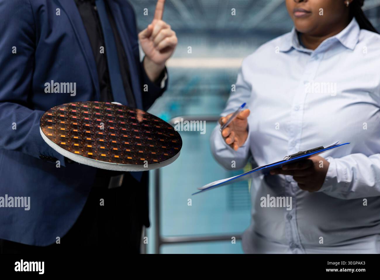 Planning semiconductor substrate upgrades, business meeting and researchers in smart factory. Evaluating advanced microchips prototype, silicon wafer close up and professionals Stock Photo