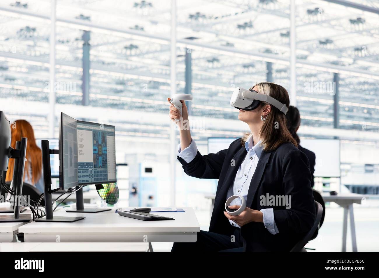 Engineer testing microchip electronics prototypes using VR technology. Worker wearing virtual reality headset ensures industrial hardware standards in semiconductors RD laboratory Stock Photo