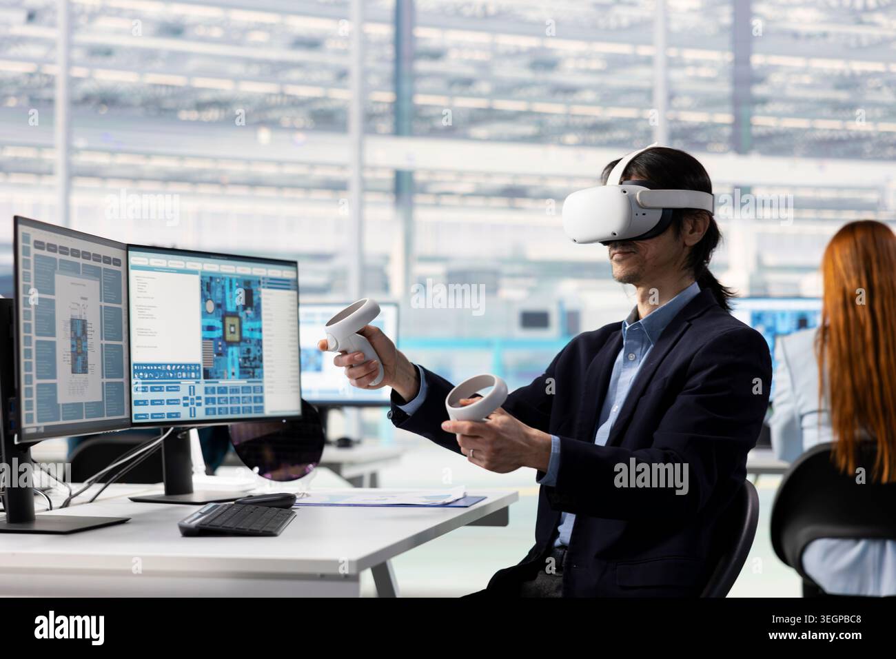 Asian man testing microchip electronics prototypes using VR tech. Senior manager wearing virtual reality goggles ensures industrial hardware standards in semiconductors RD laboratory Stock Photo