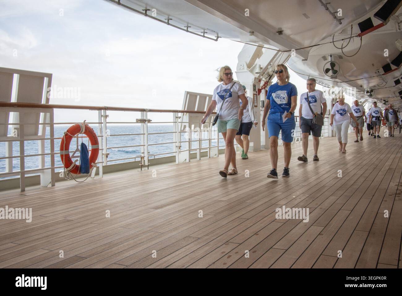 Cruise ship passengers onboard activity of walking the promenade deck as part of an organized charity fundraising event Stock Photo
