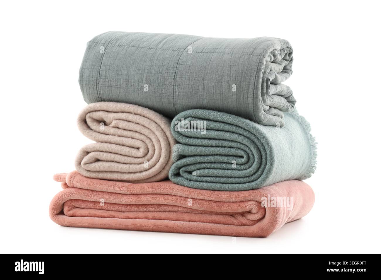 Stack of different folded blankets isolated on white background Stock Photo